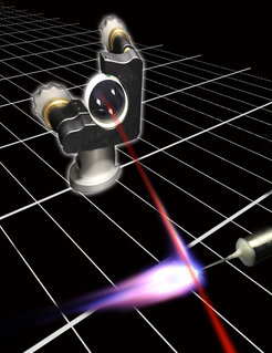 Artist’s impression of the experiment: A pulse of laser light (coming from the right, indicated in red) hits a cloud of argon atoms. The atoms absorb the light energy and re-emit it in the form of trains of attosecond pulses, at a rate of 78 million per second. A specially constructed pierced mirror with a tiny aperture (upper left) serves to capture the pulses of extreme ultraviolet radiation. The high repetition rate will make it possible to produce high-resolution movies of ultrafast alterations in the motions of electrons in atoms and molecules.