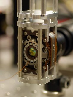 Approximately in the centre of the picture, the "mirror cabinet" can be seen from outside, which creates the connection between flying and stationary qubits.