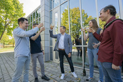 Ferenc Krausz and some members of his team cheer to the Nobel Prize which was announced shortly before.